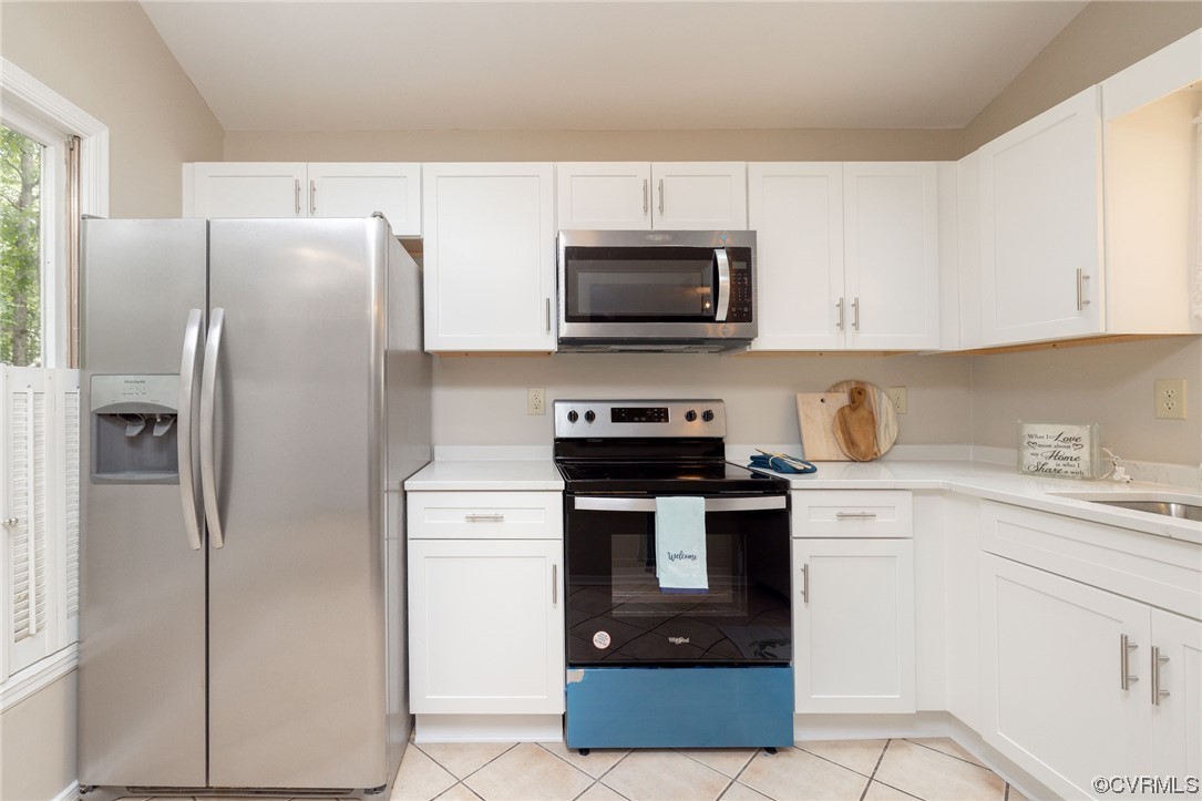 2406 Arrowood Road Midlothian, VA 23112 - Photo 13 of 39 a kitchen with stainless steel appliances granite countertop a refrigerator stove a sink and white cabinets