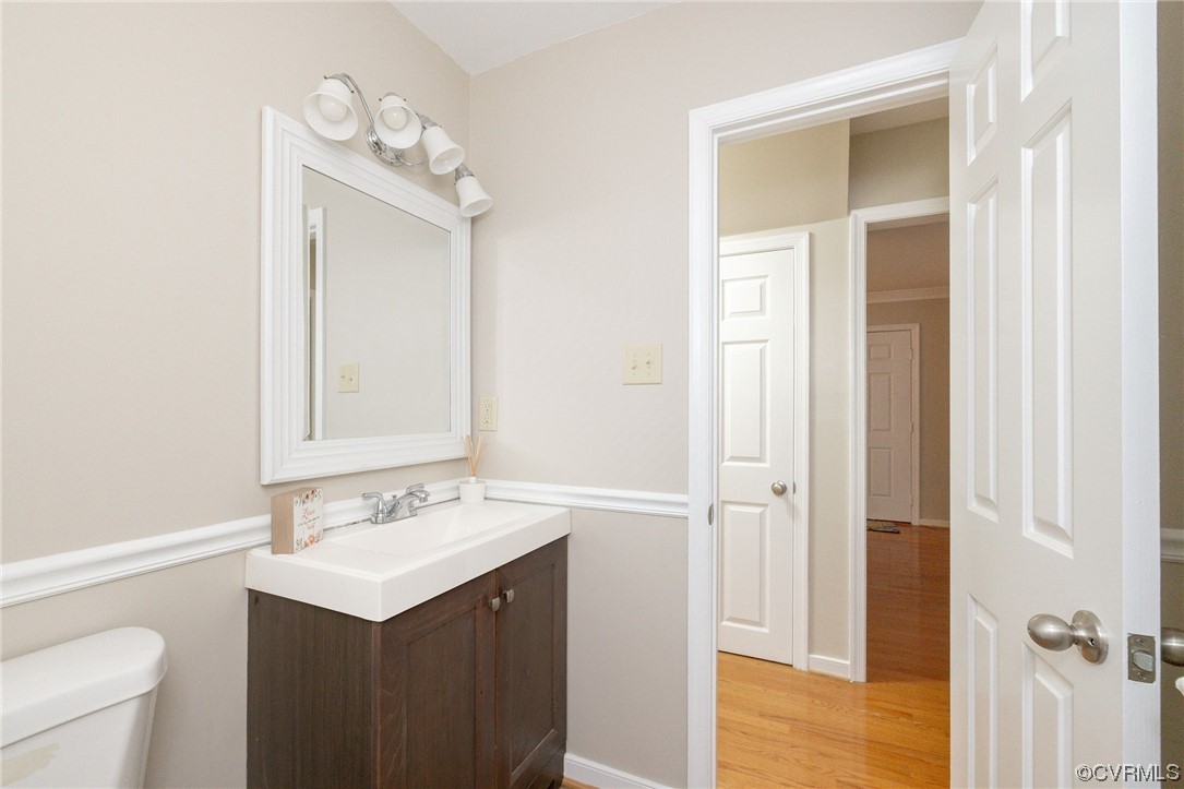 2406 Arrowood Road Midlothian, VA 23112 - Photo 22 of 39 a bathroom with a sink vanity and a mirror