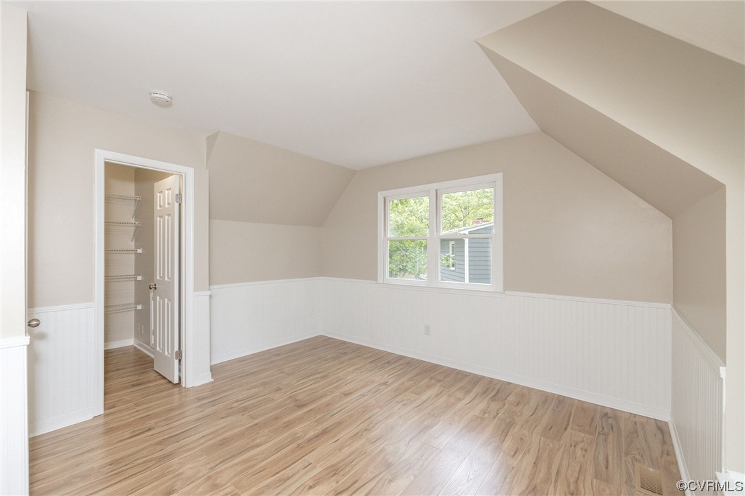 2406 Arrowood Road Midlothian, VA 23112 - Photo 26 of 39 an empty room with wooden floor and windows
