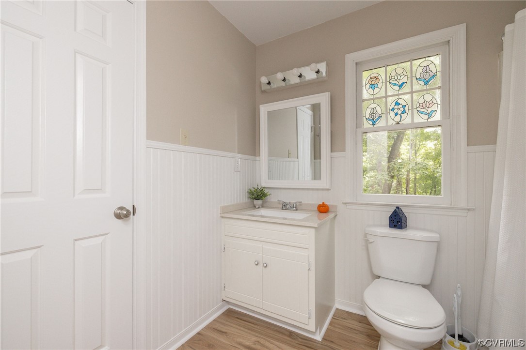 2406 Arrowood Road Midlothian, VA 23112 - Photo 29 of 39 a bathroom with a toilet a sink and a window