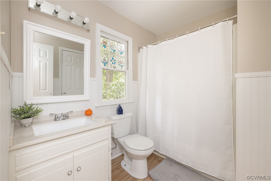 2406 Arrowood Road Midlothian, VA 23112 - Photo 30 of 39 a bathroom with a sink a toilet and a window