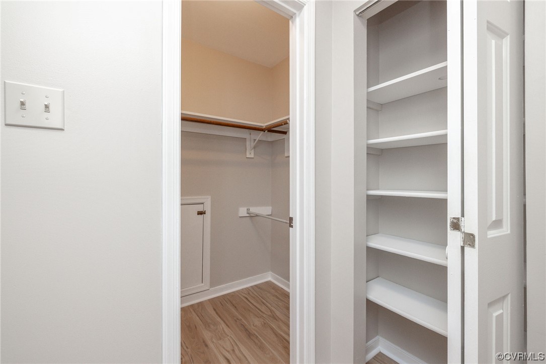 2406 Arrowood Road Midlothian, VA 23112 - Photo 34 of 39 a view of walk in closet with empty racks