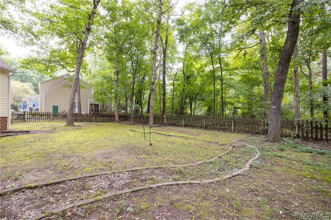2406 Arrowood Road Midlothian, VA 23112 - Photo 37 of 39 a view of a backyard with large trees