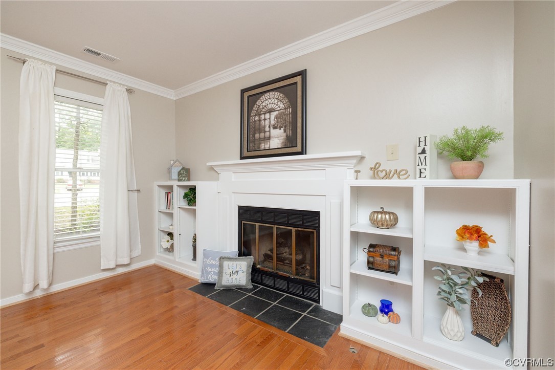 2406 Arrowood Road Midlothian, VA 23112 - Photo 7 of 39 a living room with furniture and a fireplace