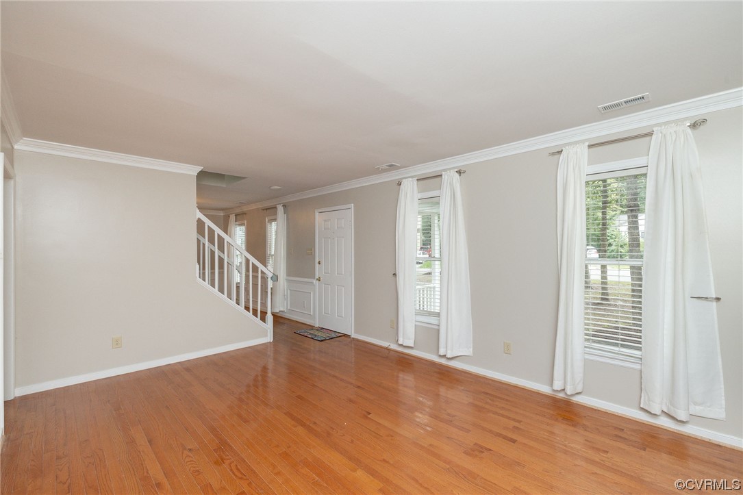 2406 Arrowood Road Midlothian, VA 23112 - Photo 8 of 39 a view of an empty room with wooden floor