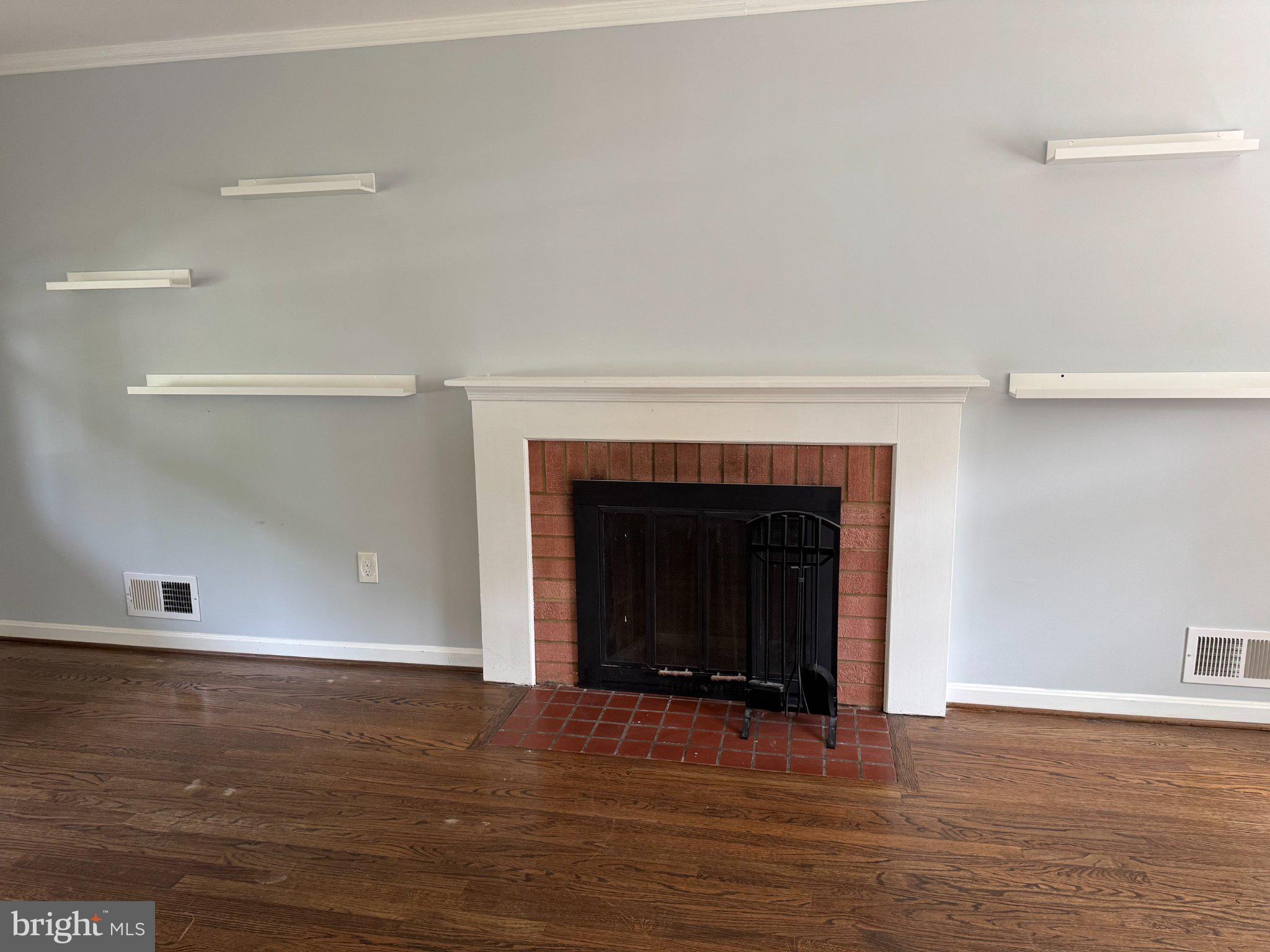 6603 Huntsman Boulevard Springfield, VA 22152 - Photo 7 of 64 Cozy fireplace with modern accents.