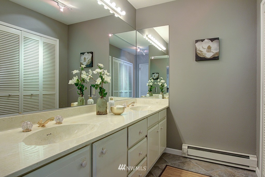 6535 Seaview Avenue Northwest, Unit 601B Seattle, WA 98117 - Photo 12 of 17 a bathroom with a sink and a mirror