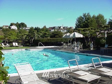 6535 Seaview Avenue Northwest, Unit 601B Seattle, WA 98117 - Photo 14 of 17 a view of a chairs and tables in the backyard
