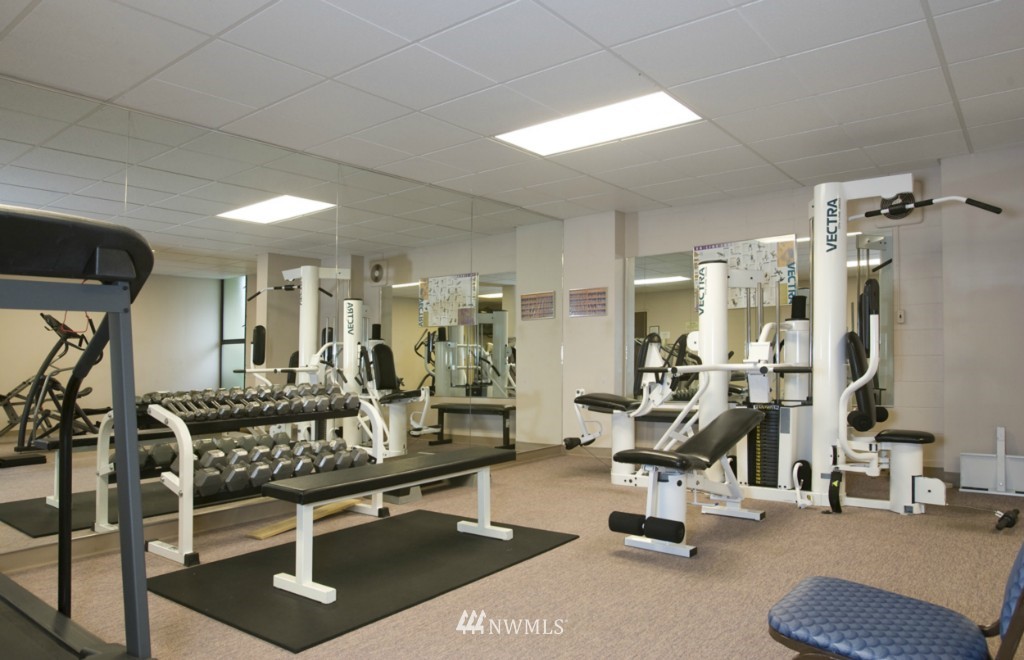 6535 Seaview Avenue Northwest, Unit 601B Seattle, WA 98117 - Photo 15 of 17 a room with gym equipment and a table