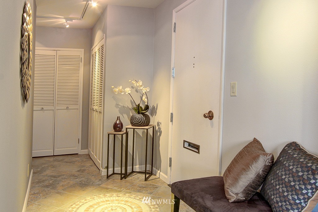 6535 Seaview Avenue Northwest, Unit 601B Seattle, WA 98117 - Photo 7 of 17 a view of a livingroom with furniture and staircase