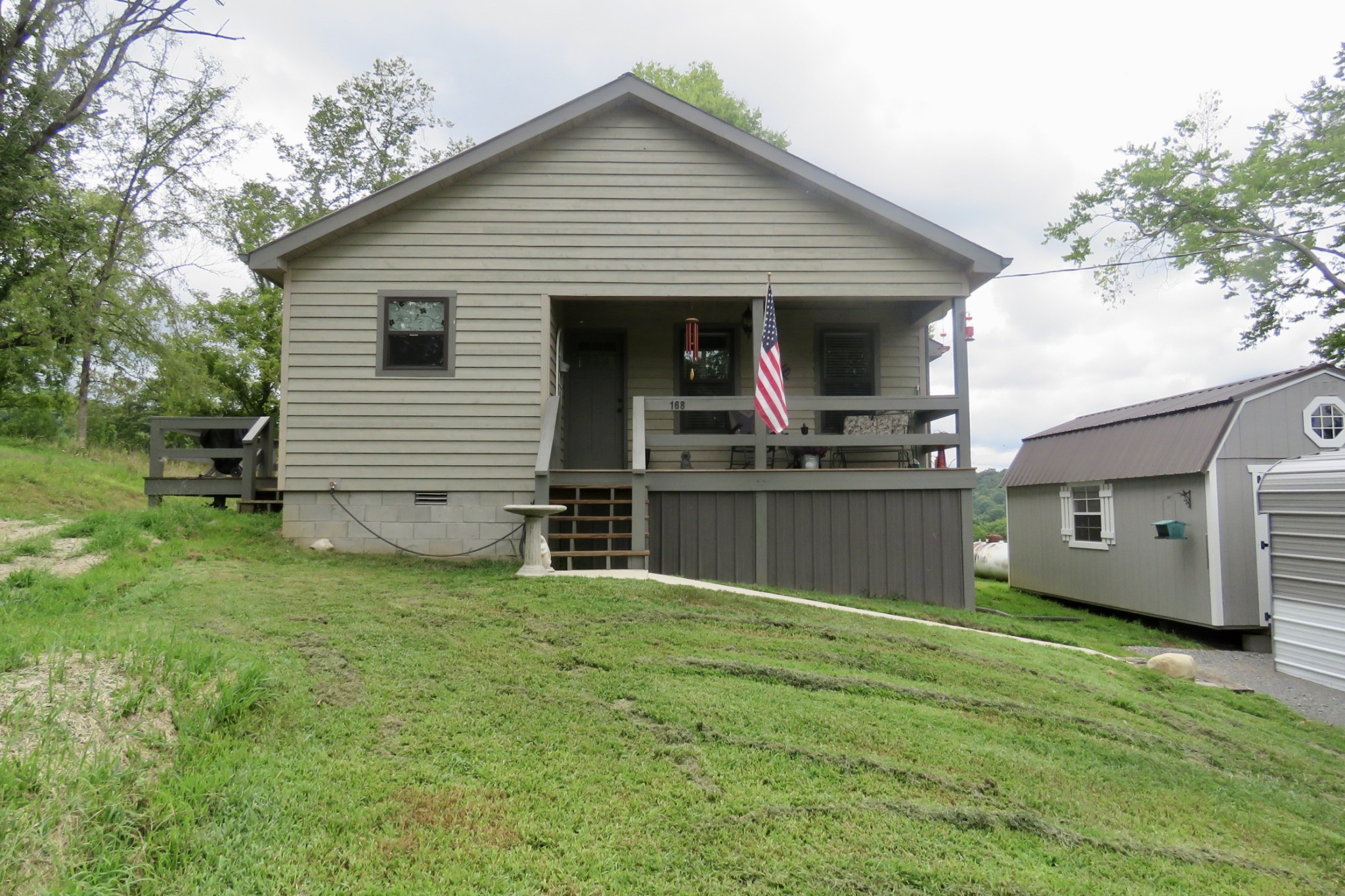 a view of a house with a backyard