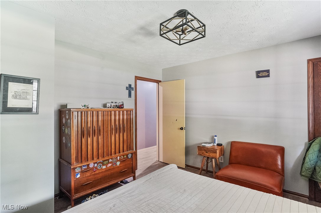 649 South Medina Line Road Akron, OH 44321 - Photo 27 of 50 Bedroom with a textured ceiling