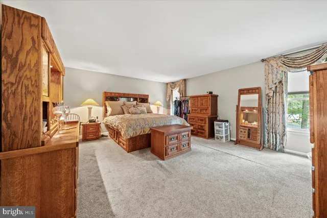 a bed room with a bed and a television