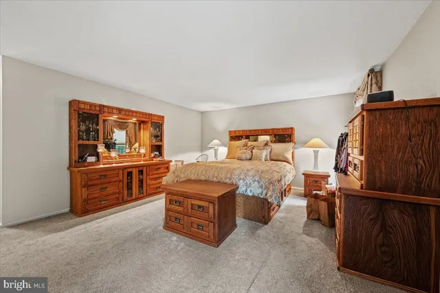 a bathroom with a toilet sink and shower