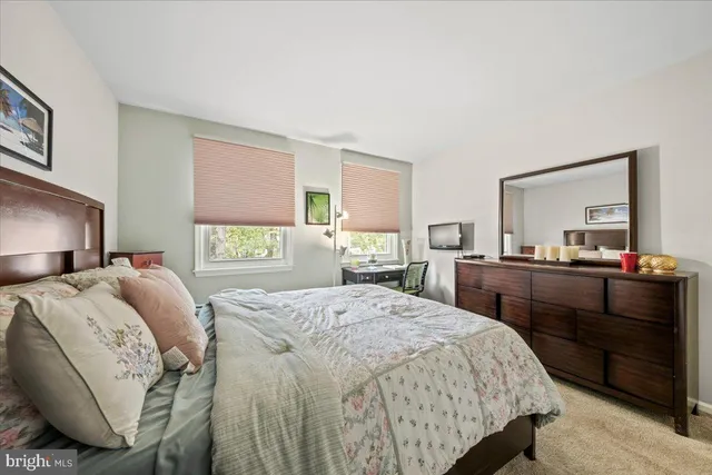 a view of a roof deck with table and chairs