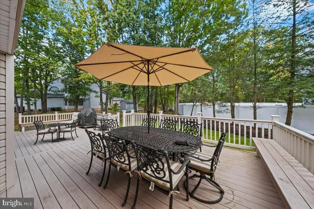a view of sitting area with furniture and wooden floor