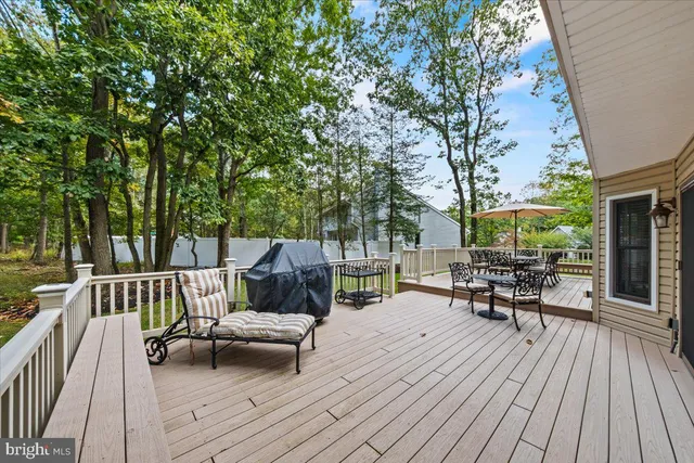a view of a house with backyard porch and sitting area
