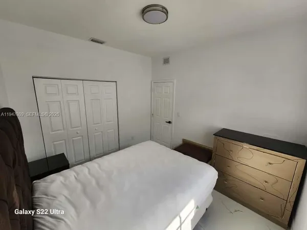 a view of a hallway with a livingroom