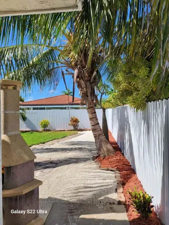 a view of a pathway of a house with wooden floor