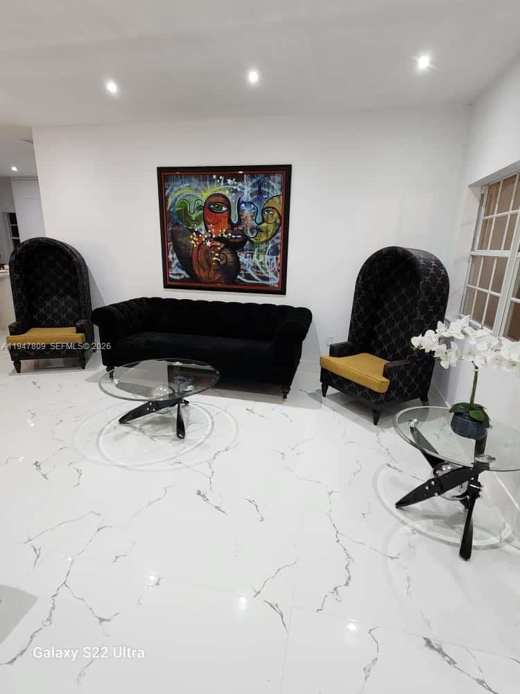 18252 Southwest 146th Avenue Miami, FL 33177 - Photo 5 of 46 a living room with furniture and a gym equipment