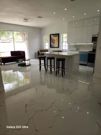 a kitchen with kitchen island granite countertop lots of counter top space