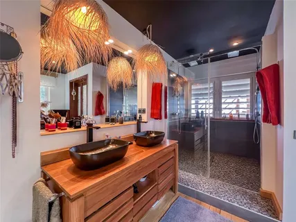a view of a dining room with furniture and a chandelier