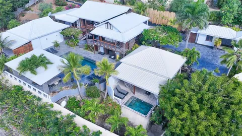 an aerial view of a house with a garden