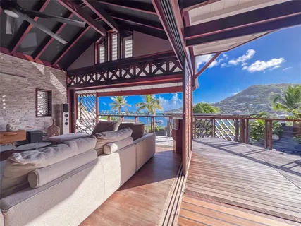 a view of a patio with a table and chairs