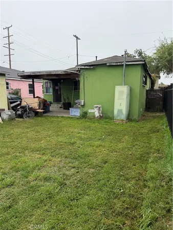 a view of a fire pit in front of house