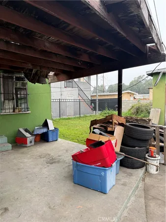 a backyard of a house with yard and outdoor seating