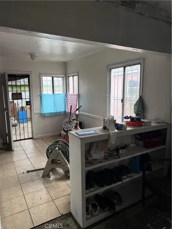 a view of a kitchen with a sink and cabinets