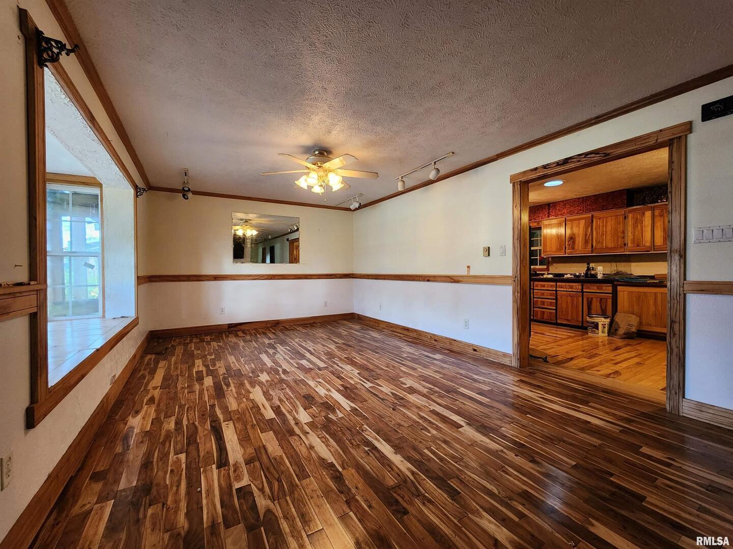 5628 Coal Street Sesser, IL 62884 - Photo 11 of 62 a view of empty room with wooden floor and fan
