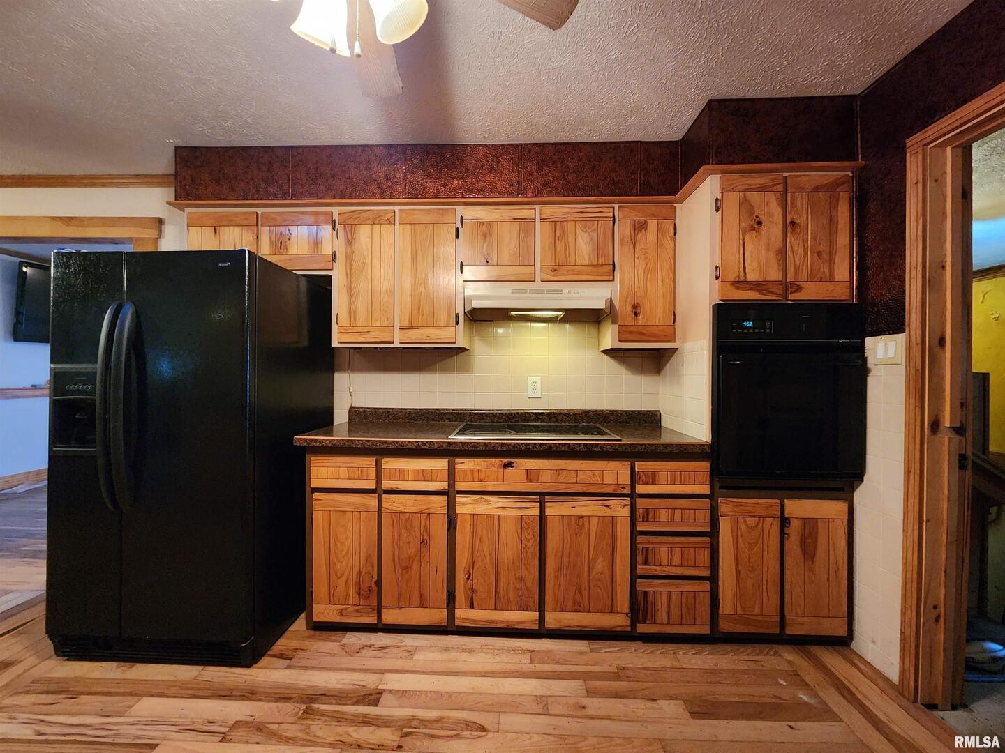 5628 Coal Street Sesser, IL 62884 - Photo 13 of 62 a kitchen with stainless steel appliances granite countertop a refrigerator and a sink