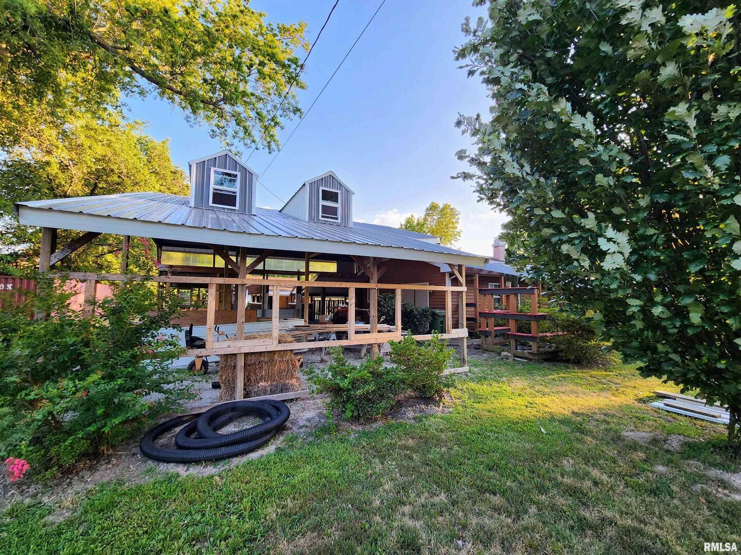 5628 Coal Street Sesser, IL 62884 - Photo 2 of 62 a front view of a house with a yard table and chairs