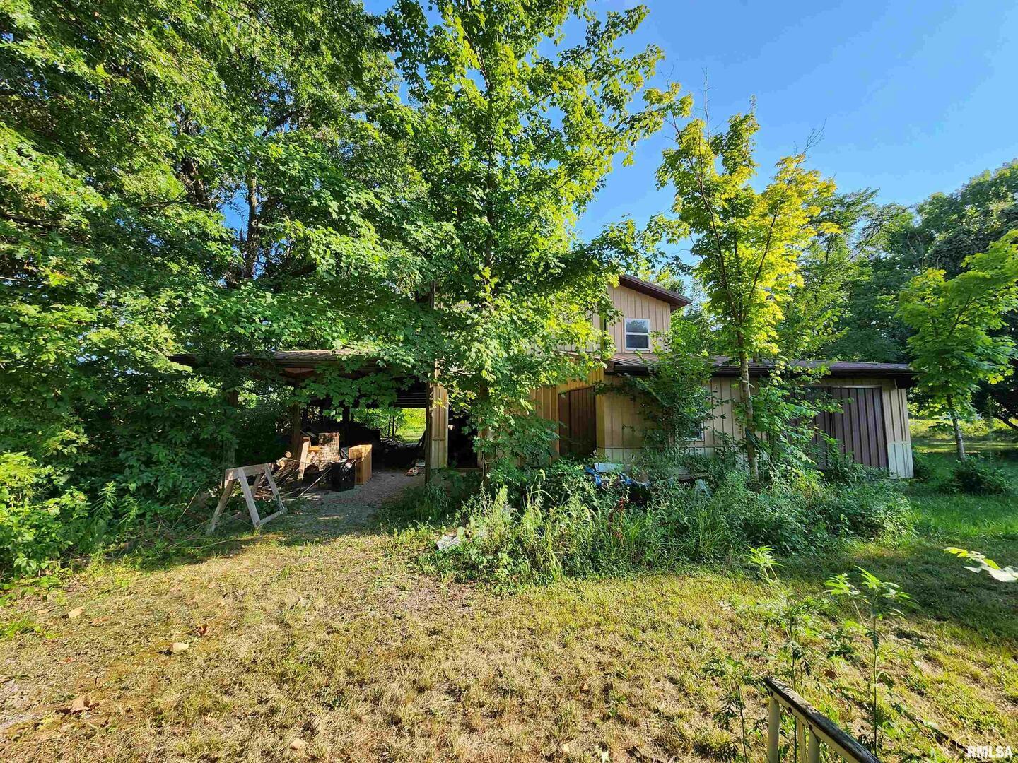 5628 Coal Street Sesser, IL 62884 - Photo 52 of 62 a backyard of a house with yard and outdoor seating
