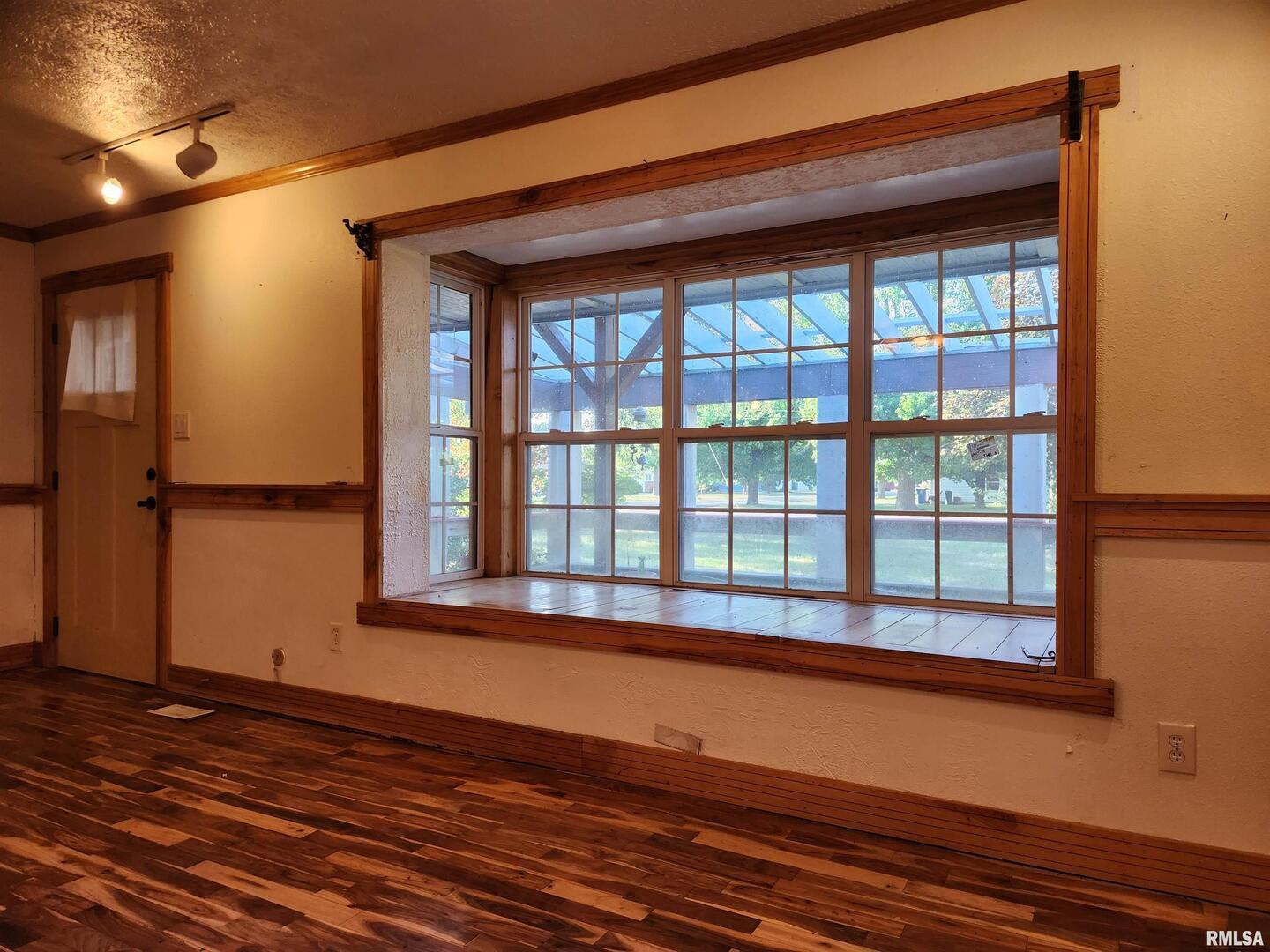 5628 Coal Street Sesser, IL 62884 - Photo 10 of 62 a view of an empty room with wooden floor and a window