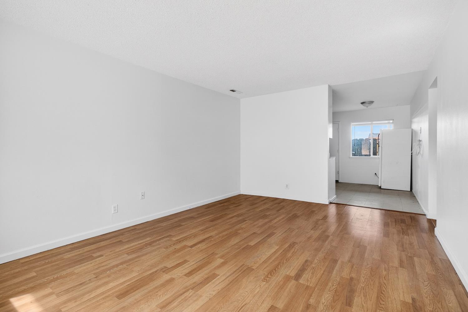 1962 Edwards Avenue Merced, CA 95340 - Photo 14 of 22 a view of empty room with wooden floor