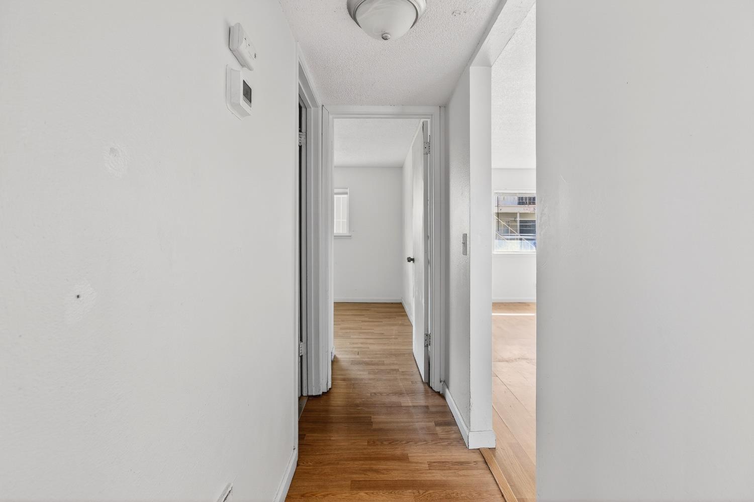 1962 Edwards Avenue Merced, CA 95340 - Photo 18 of 22 a view of a hallway with wooden floor