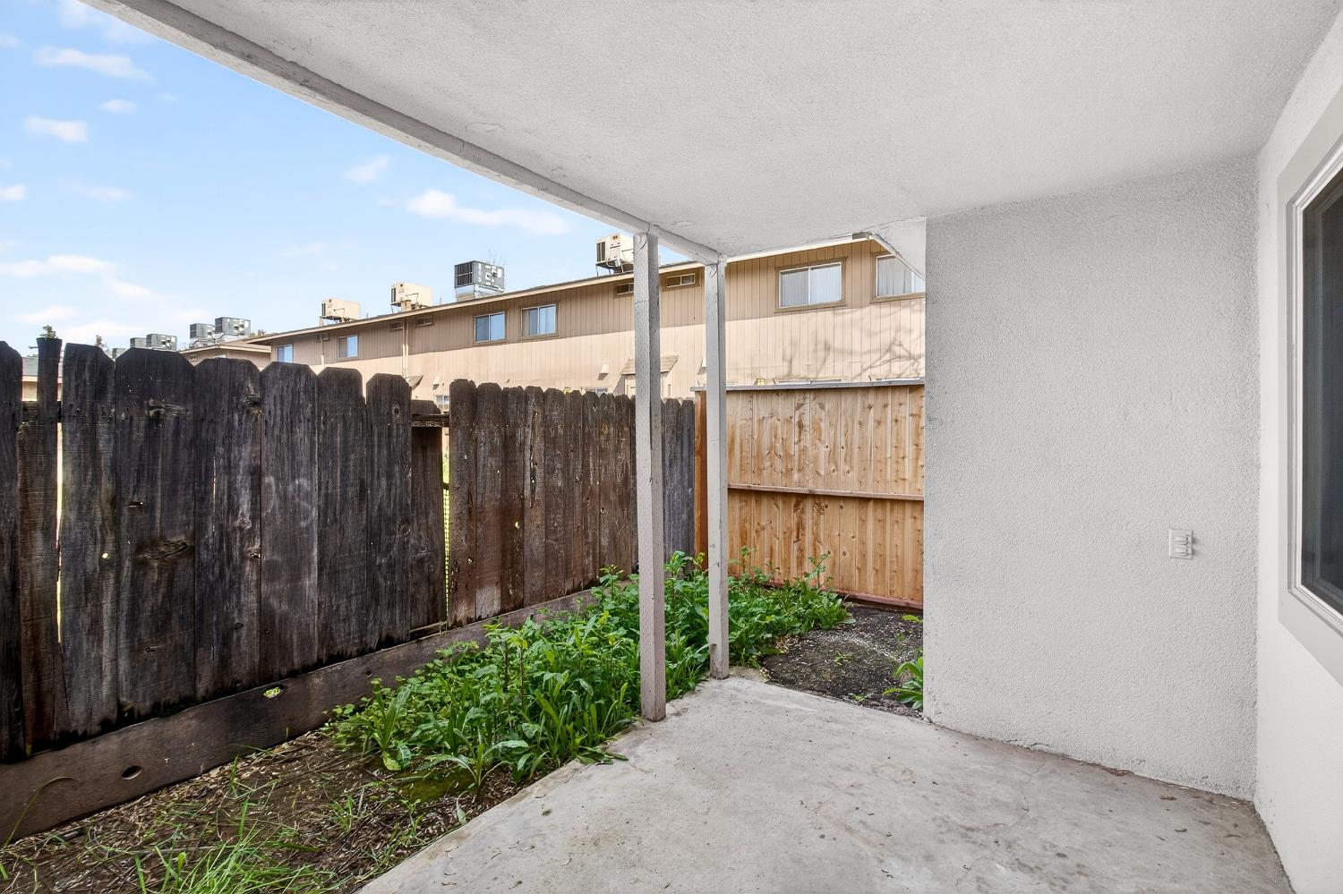 1962 Edwards Avenue Merced, CA 95340 - Photo 21 of 22 a view of a house with a backyard and plants