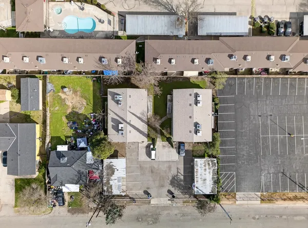 an aerial view of a house with outdoor space