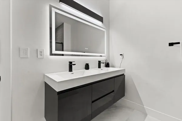 a bathroom with a glass shower door