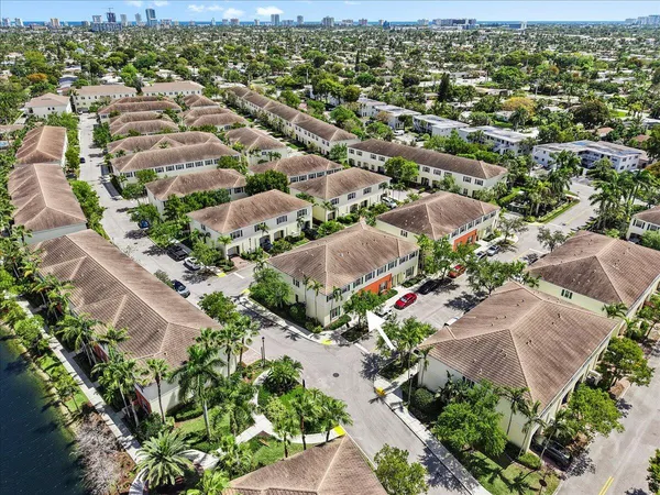 an aerial view of a houses with flower plants