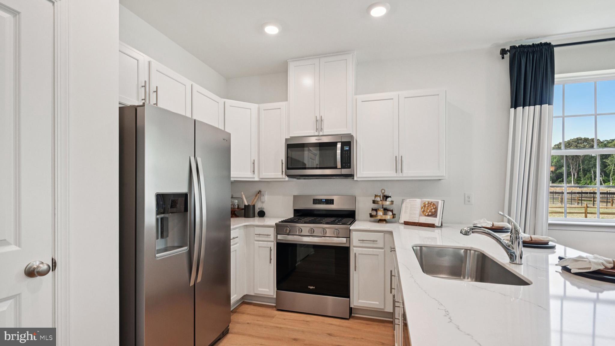 60 Robert Drive Runnemede, NJ 08078 - Photo 18 of 48 a kitchen with a refrigerator sink and microwave