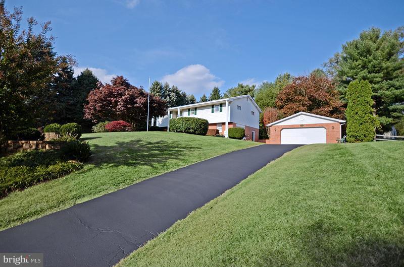 3211 Hunt Road Fallston, MD 21047 - Photo 1 of 25 a front view of a house with a yard and garage