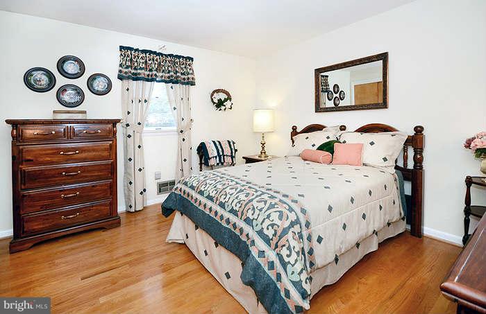 3211 Hunt Road Fallston, MD 21047 - Photo 11 of 25 a bedroom with a bed and painting on the wall
