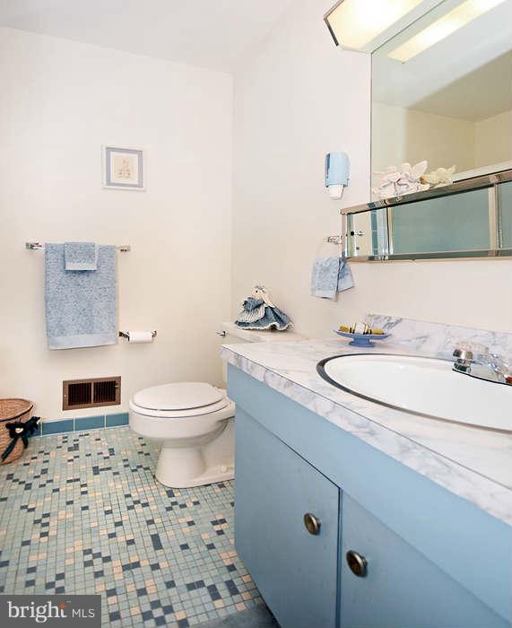 3211 Hunt Road Fallston, MD 21047 - Photo 16 of 25 a bathroom with a granite countertop sink a toilet and a mirror