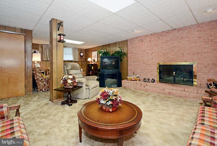3211 Hunt Road Fallston, MD 21047 - Photo 18 of 25 a living room with furniture a flat screen tv and a fireplace