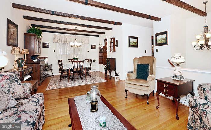 3211 Hunt Road Fallston, MD 21047 - Photo 4 of 25 a living room with furniture and a painting on the wall