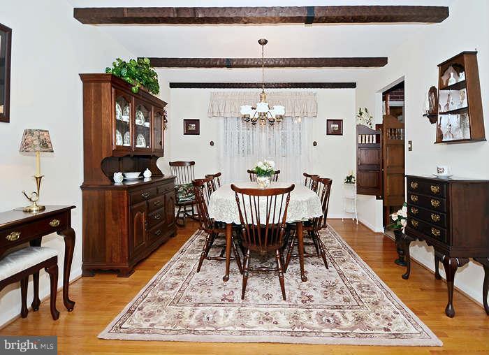 3211 Hunt Road Fallston, MD 21047 - Photo 6 of 25 a dining room with wooden floor and a rug