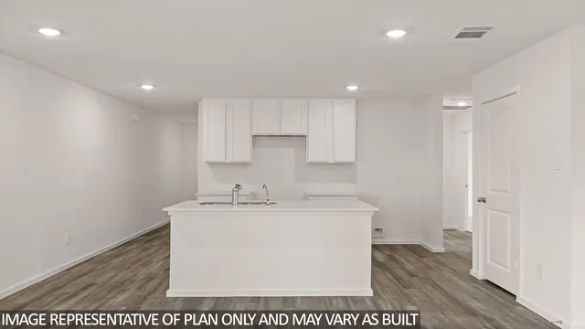 a room with a sink a washer and dryer